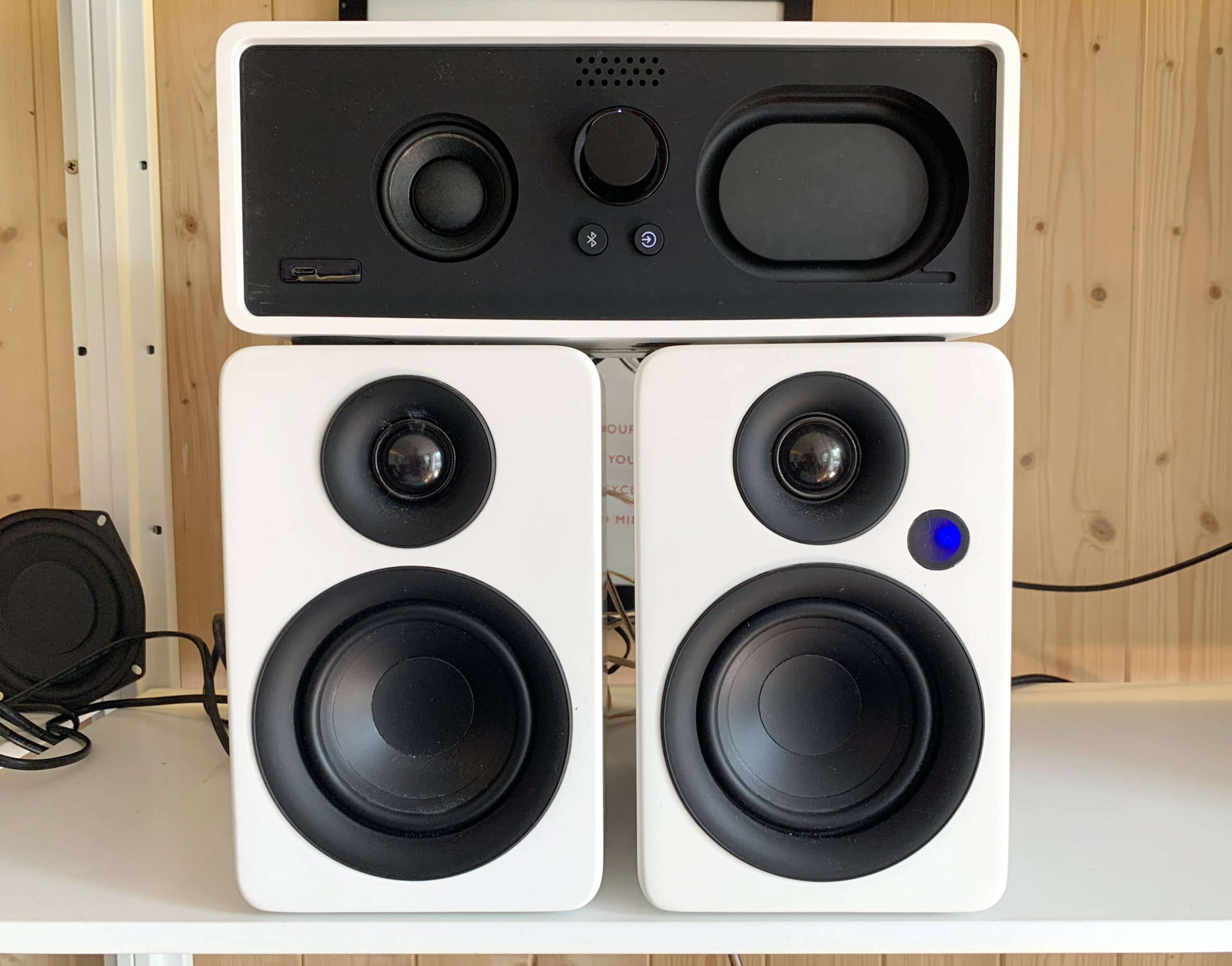 Dock E30 sitting atop a pair of reference stereo speakers